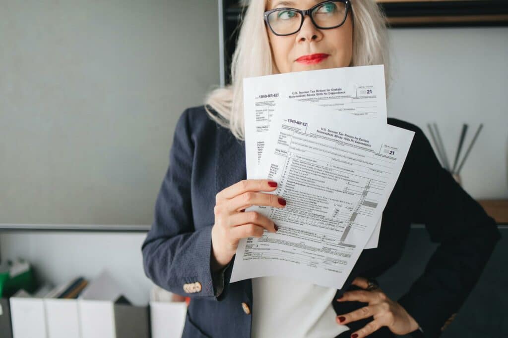 Woman in a blazer with tax forms