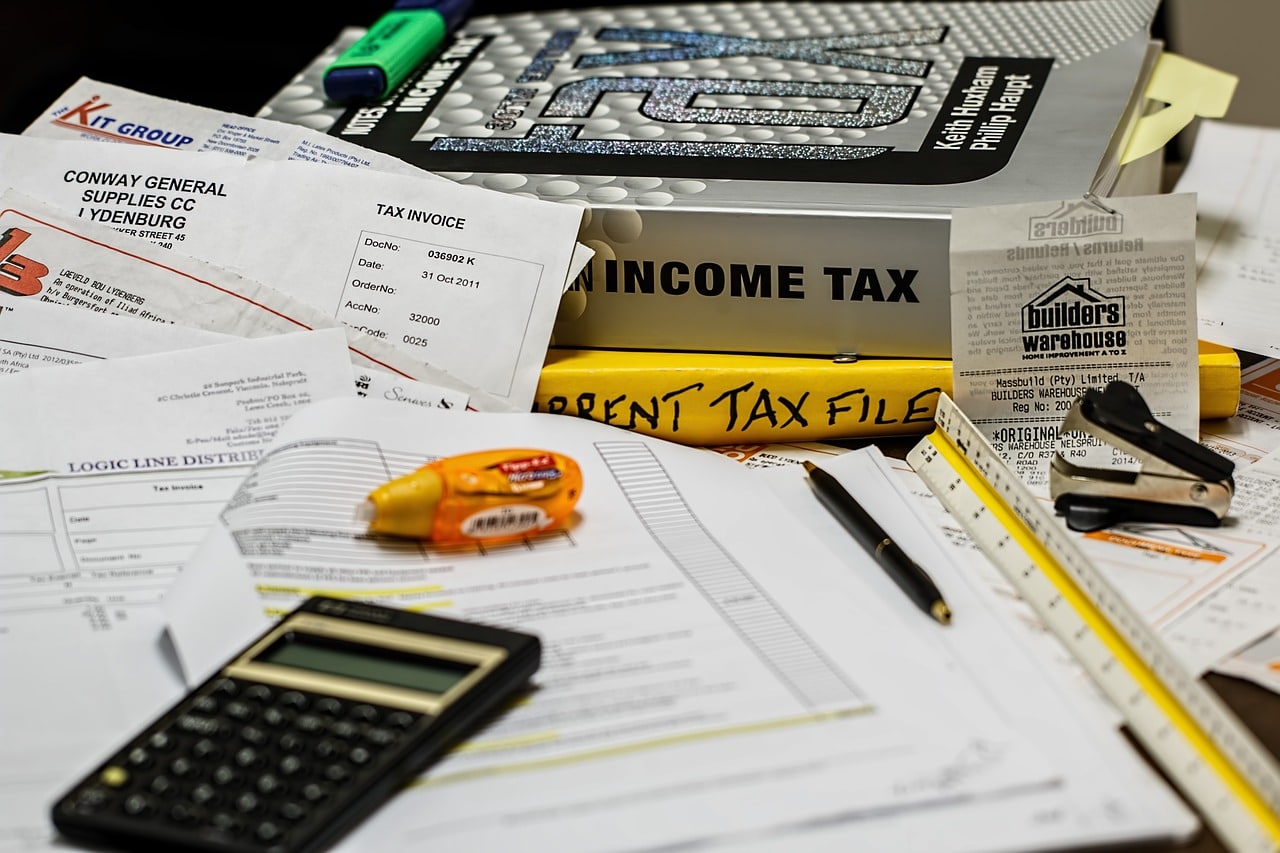 Documents, books, and office supplies on a table