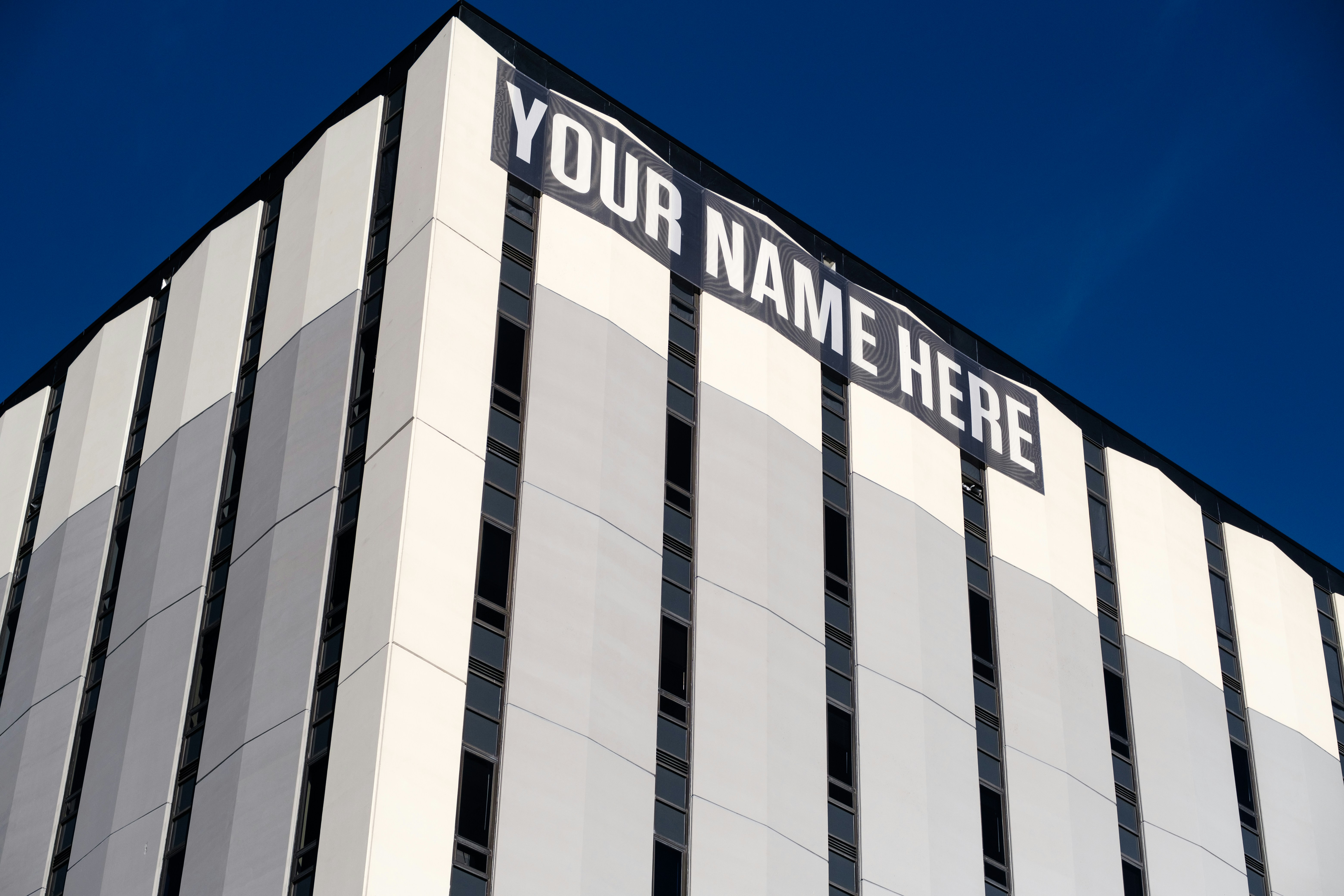 gray and black building under blue sky during daytime