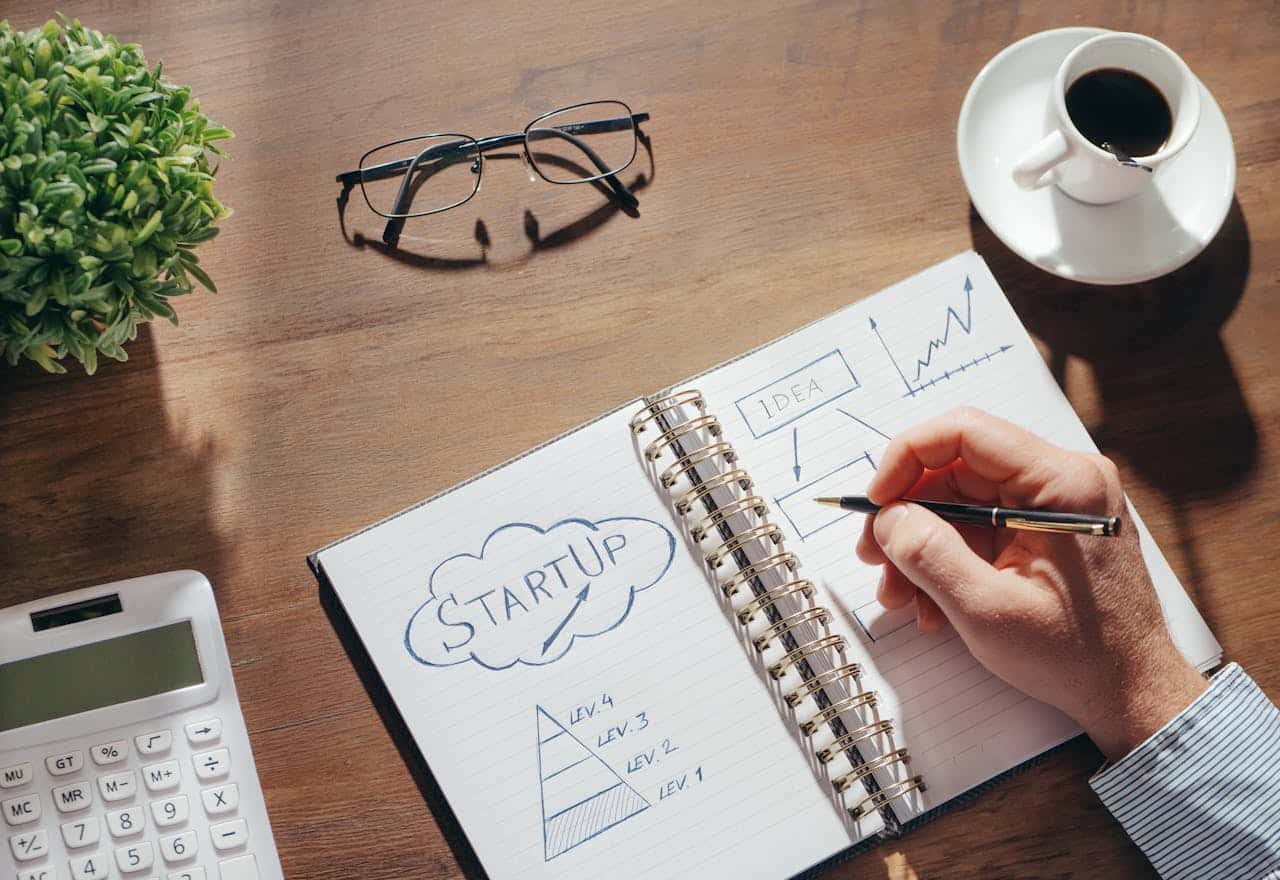 A man writing in a notebook