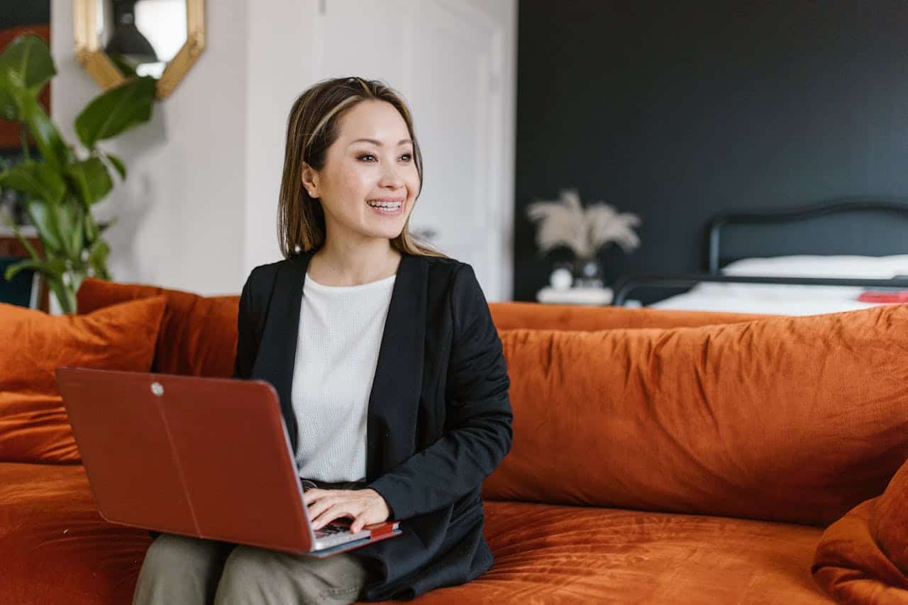 Smiling woman on her laptop