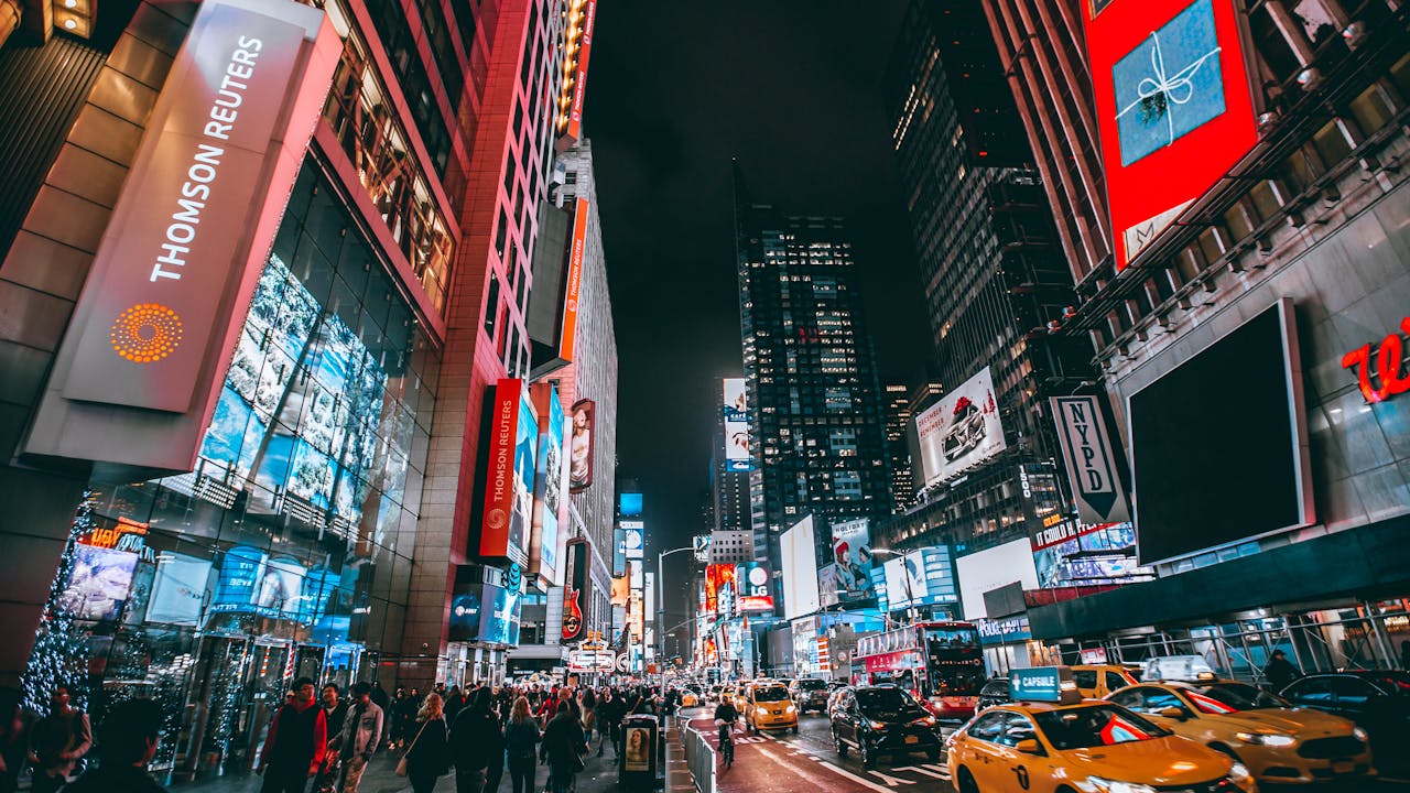 A busy street in New York with signs of businesses