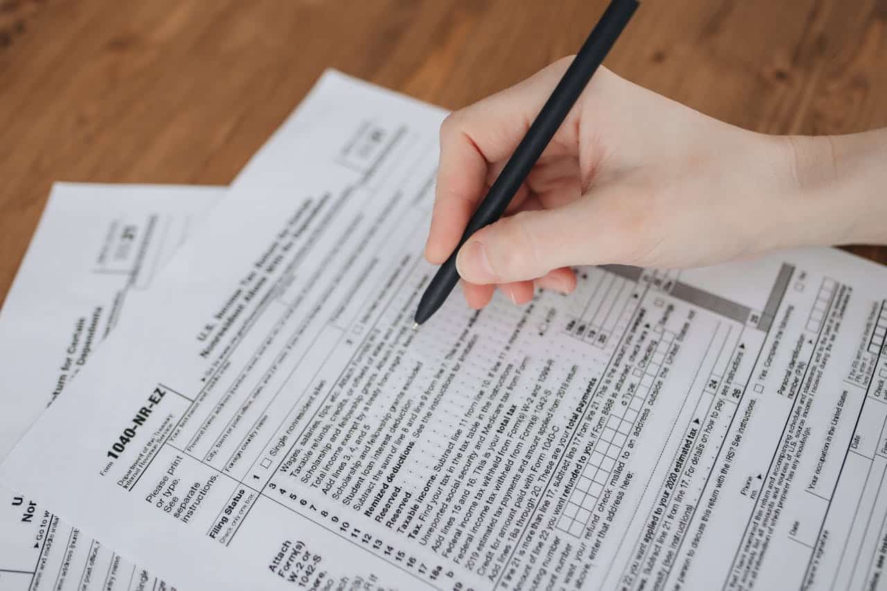 A person filling out an IRS tax return