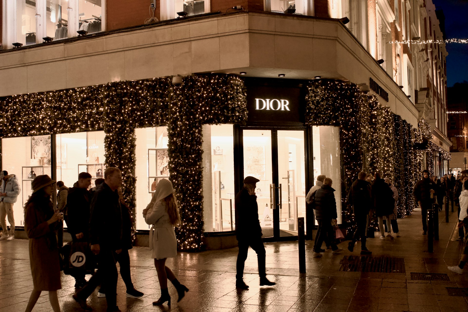 A Dior storefront with small lights around it