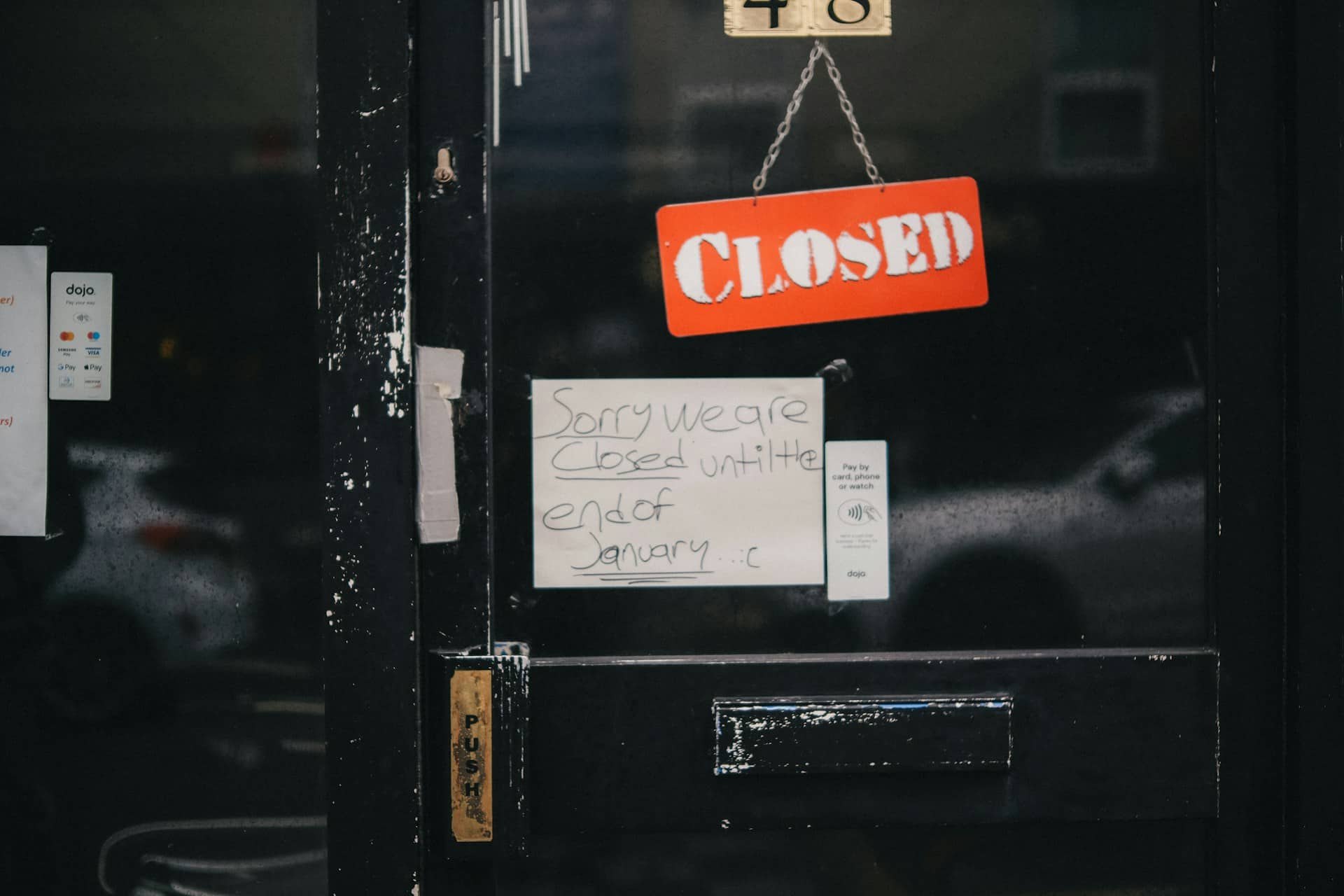 A door with a closed sign and a message on it