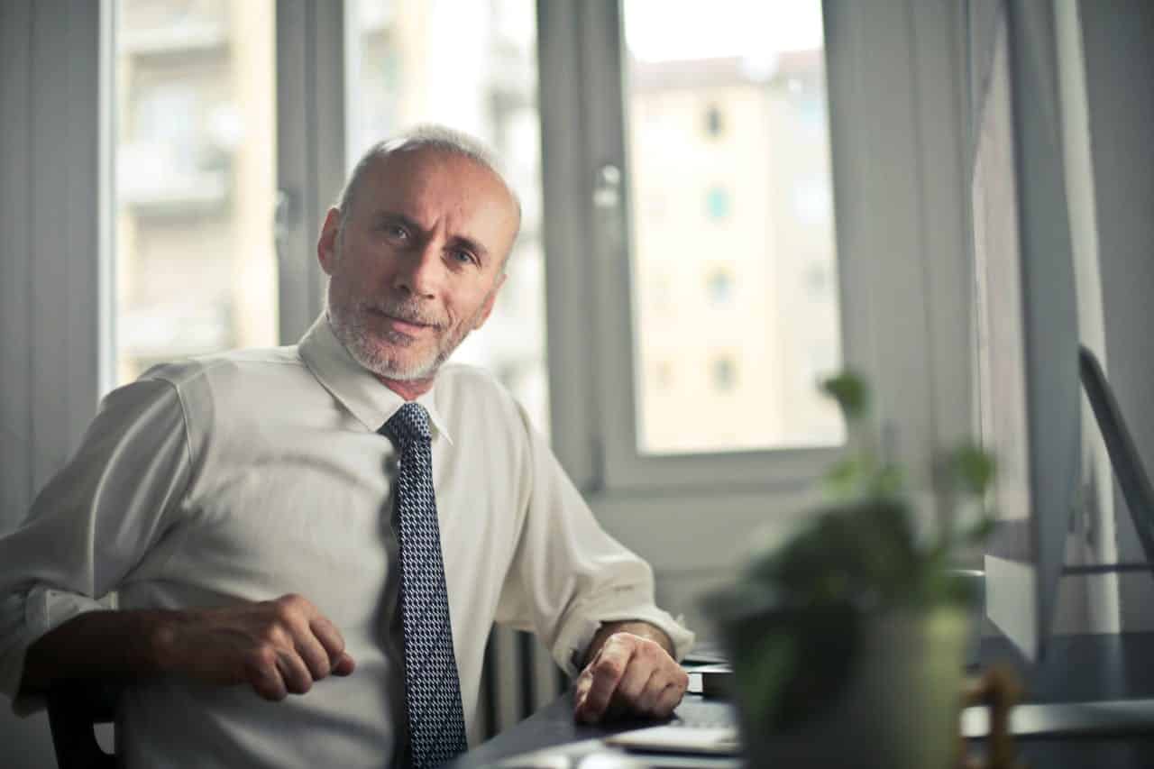 A man sitting beside a table