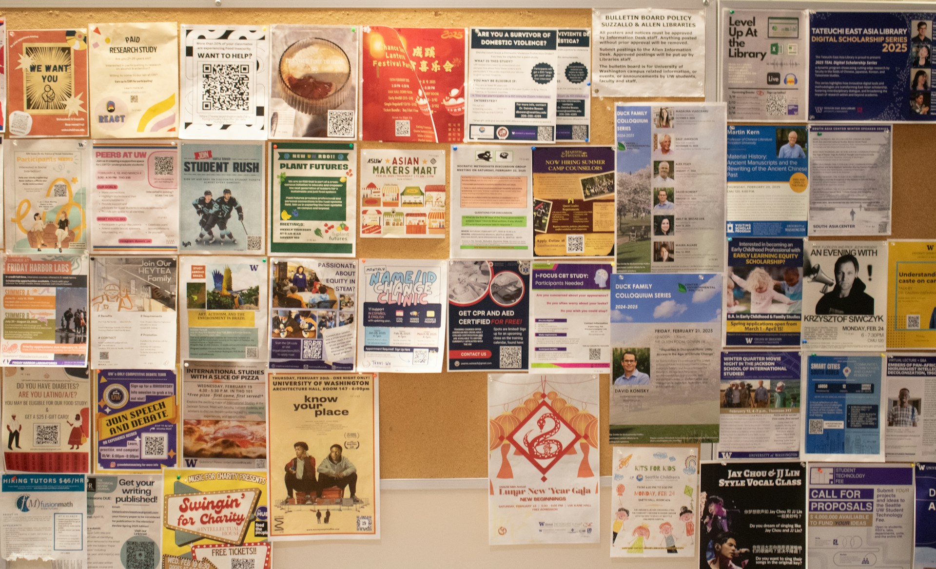 A bulletin board with various posters and flyers