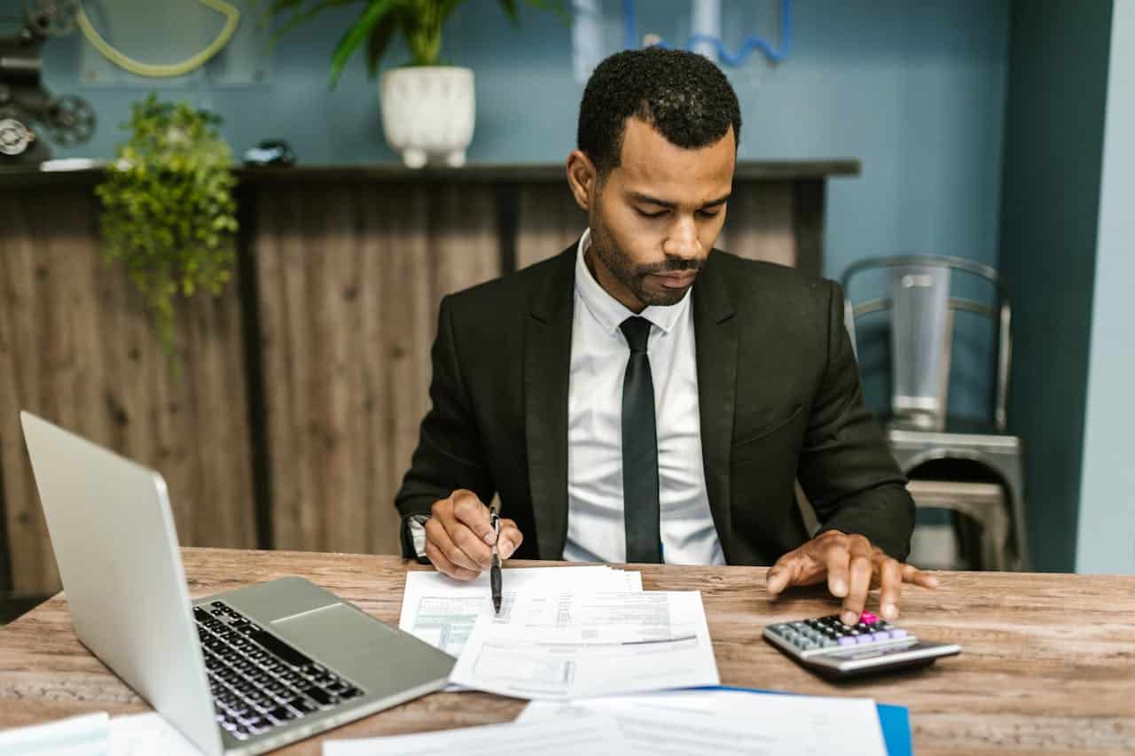 A male accountant working at his table