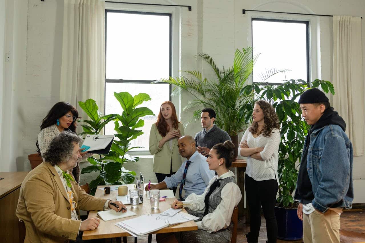 Employees gathering around a table
