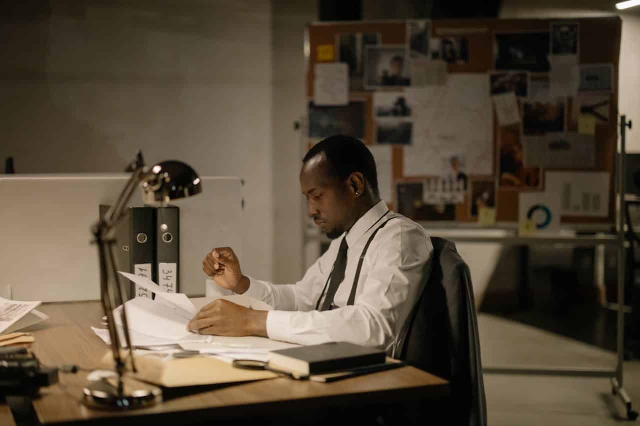 A man reading documents at his table