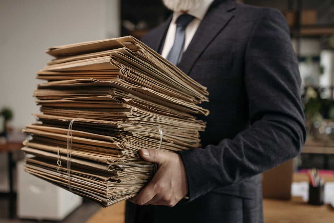 A man carrying folders