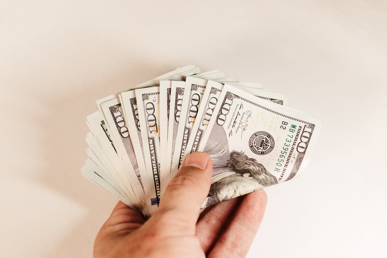Dollar bills in hand