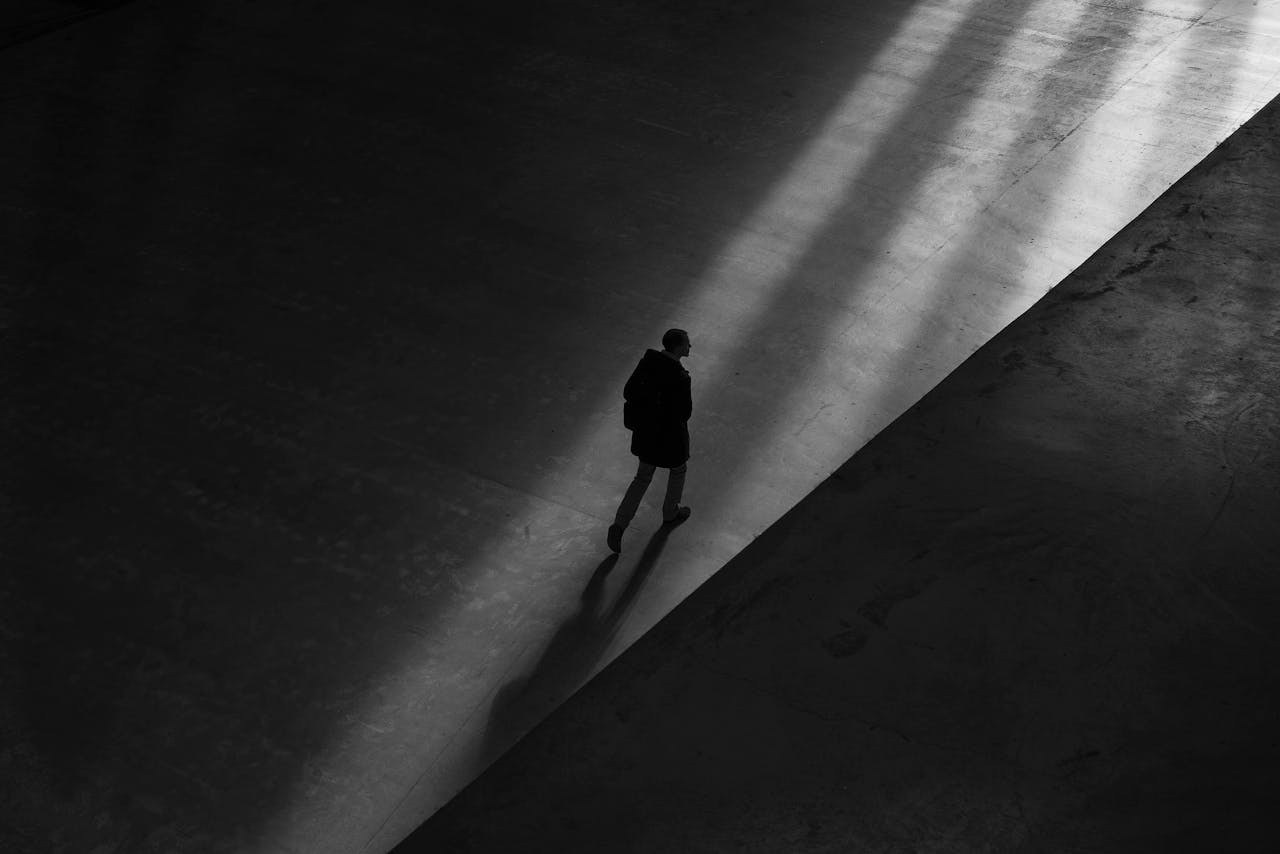 A man walking to a well-lit area