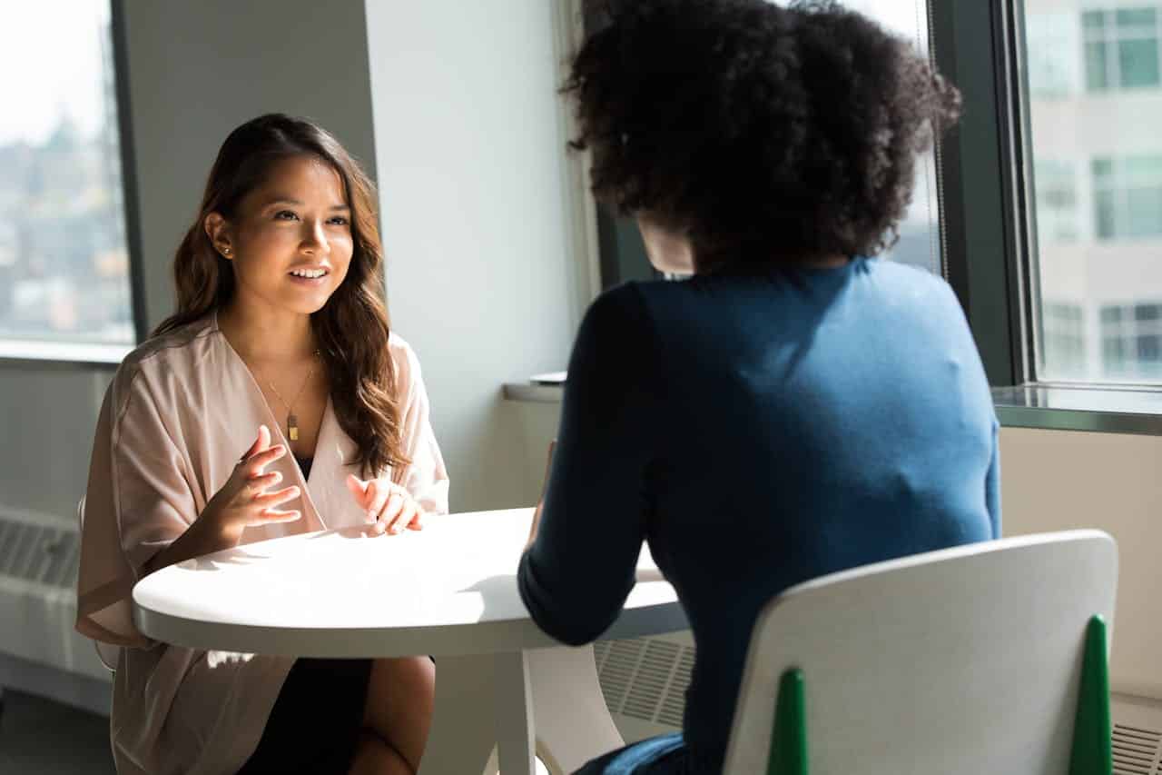 Two women speaking