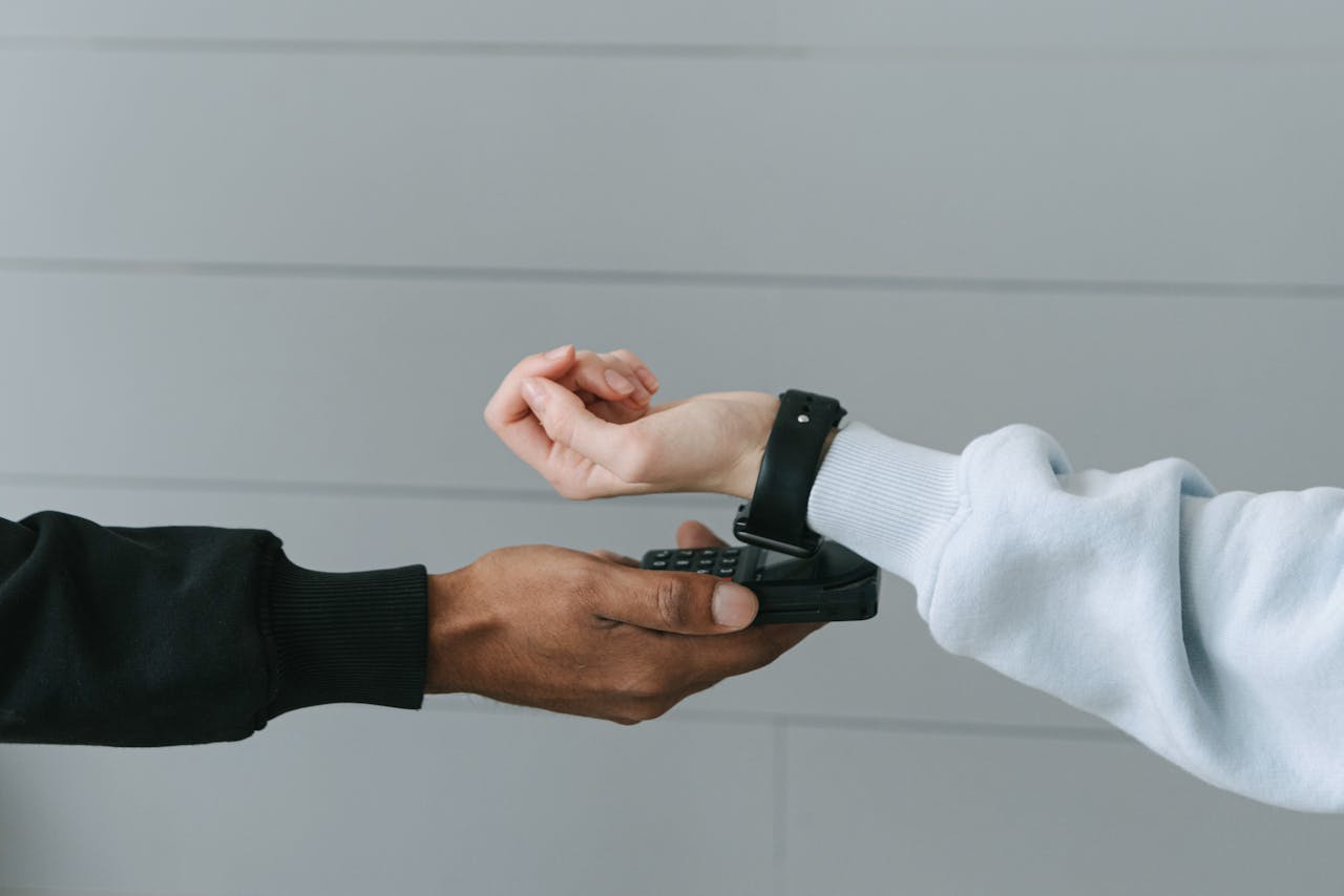 Person paying with their smartwatch