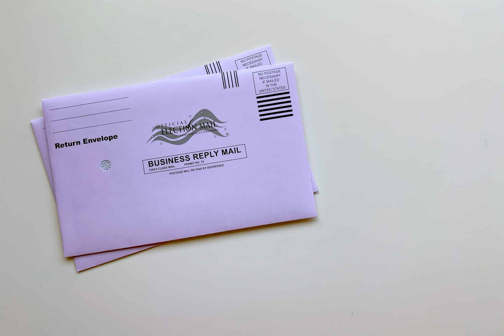 Two purple envelopes on a white background