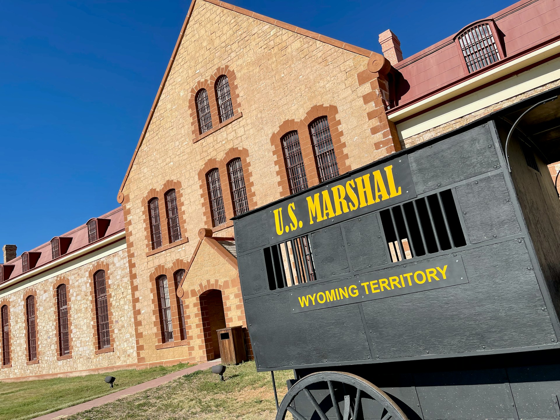 A historical site in Wyoming with a wagon parked in front of it