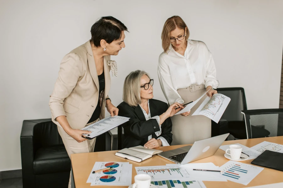 Business women looking at paper