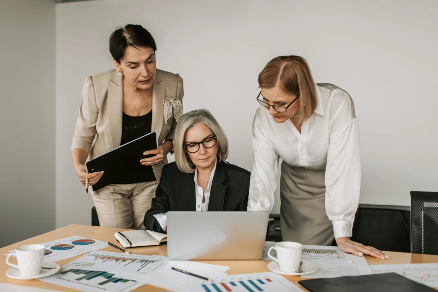 Business women looking at laptop